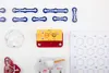 A collection of electronic building blocks and components are laid out on a white surface. Podgląd zdjęcia produktu
