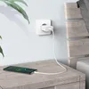 A smartphone is charging on a nightstand next to a wall outlet with a charger plugged in. Produktbild-Vorschau