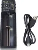 A black battery charger and a USB cable are shown on a white background. Náhled obrázku produktu