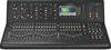 A digital audio mixer console with numerous faders, knobs, buttons, and a screen displaying audio levels. Anteprima dell’immagine prodotto