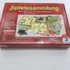 The image shows the top and side of a board game box. The box is red with yellow text and features images of various board games. The Schmidt logo is visible on the right side. Anteprima dell’immagine prodotto