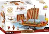 The image shows the packaging of a COBI building block set depicting a Roman warship. The box features images of the assembled model, its components, and miniature figures. Voir les images du produit