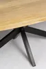 A close-up view of the base of an oval wooden table with a black metal base. Voir les images du produit