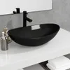 A black glass sink on a white countertop with a black faucet. Anteprima dell’immagine prodotto