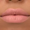 A close-up shot of a person's lips wearing matte pink lipstick. Produktbild-Vorschau