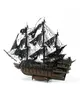 A 3D model of a pirate ship with tattered black sails, displayed against a white background. Náhľad obrázku produktu