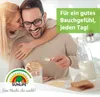 A couple enjoying breakfast together, with the woman hugging the man from behind. Produktbild-Vorschau