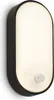 A black and white oval-shaped LED wall light with a motion sensor is mounted on a white wall. Anteprima dell’immagine prodotto