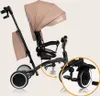 A child's tricycle with a canopy and parent handle, shown against a plain background. A close-up inset highlights the rear wheel and pedals. Anteprima dell’immagine prodotto
