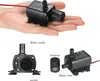 A collage of images showing a small black submersible water pump, with one image showing it held in a hand, and other images showing close-ups with labels. Podgląd zdjęcia produktu