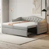 A light gray sofa bed is shown in a room with a rug and wall art. Produktbild-Vorschau