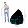 A man stands next to a bean bag chair with a binary code pattern. Voir les images du produit