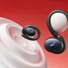 Two black wireless earbuds with red accents are shown against a red and white background. One earbud is in the foreground, and the other is in the midground. Produktbild-Vorschau