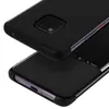 Two black smartphone cases are shown, one on top of the other, with a white background. Podgląd zdjęcia produktu
