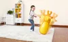 A young girl is playing with an inflatable giraffe bop bag in a room. Produktbild-Vorschau