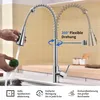 A kitchen faucet being demonstrated in a kitchen setting. Podgląd zdjęcia produktu