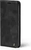 A black flip-style phone case with brown stitching and a small circular logo on the bottom left. Produktbild-Vorschau