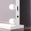 A close-up of the side of a white makeup mirror, showing a USB port and a power input. Náhled obrázku produktu