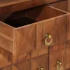 A close-up view of a wooden dresser drawer with a brass handle. Podgląd zdjęcia produktu