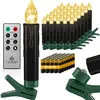 A collection of battery-operated LED Christmas tree candles with a remote control and batteries, arranged on a white background. Produktbild-Vorschau