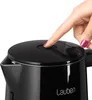 A close-up shot of a person's finger pressing a button on the lid of a black electric kettle. Anteprima dell’immagine prodotto