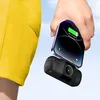 A hand holding a smartphone and a power bank. Produktbild-Vorschau
