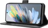 A black flip case for a smartphone is shown open, displaying the phone's screen with a colorful abstract wallpaper. Náhled obrázku produktu