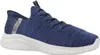 A blue Skechers slip-on shoe with a white speckled sole, shown from the side against a white background. Produktbild-Vorschau