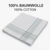 A folded white handkerchief with green stripes is shown on a white background. Produktbild-Vorschau