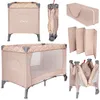 A collage of images showing a beige travel crib in various states: assembled, folded, and with its carrying bag and folded mattress. Náhled obrázku produktu