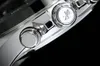 A close-up view of the side of a silver watch, showing two buttons and a Bluetooth symbol. Náhled obrázku produktu