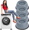 A woman is sitting on a washing machine, with a set of anti-vibration pads next to it. Voir les images du produit