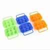 Three sets of plastic egg holders in green, blue, and orange, arranged on a white background. Produktbild-Vorschau