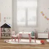 A child's bedroom with a pink table and chairs set, a toy shelf, and a toy chest. Produktbild-Vorschau