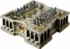 A detailed, ornate chess set with intricately designed pieces and a stone-like board structure. Podgląd zdjęcia produktu