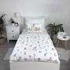 A child's bed with bedding featuring a forest animal print. Produktbild-Vorschau