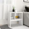 A white side table with two compartments, one holding a stack of books and the other a yellow toy car. It is placed on a rug next to a sofa and a window with white curtains. Anteprima dell’immagine prodotto