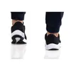 Close-up view of the back of two black and white Under Armour sneakers. Produktbild-Vorschau