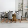 A dining room set with chairs around a table. Náhled obrázku produktu