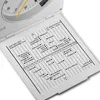 A close-up view of an open travel alarm clock with a world time zone chart displayed on the inside cover. Voir les images du produit