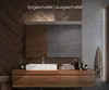 A modern bathroom vanity with a sink and mirror, featuring wooden cabinetry and a stone-like wall. Produktbild-Vorschau