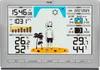 A digital weather station displaying time, date, temperature, humidity, pressure, and sun/moon information, with a cartoon graphic of a person on a beach. Anteprima dell’immagine prodotto