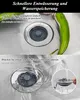 A split image showing a sink drain with a stopper in two states: closed and open with water draining. A green pepper is visible in the top image. Produktbild-Vorschau