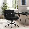 A black cat-themed office chair is placed next to a desk in a well-lit room with a window. Voir les images du produit