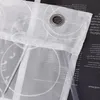 A close-up of a white sheer curtain with a circular pattern and grommets, layered over a black background with text. Produktbild-Vorschau