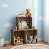 A child's room with wooden crates used for storage, filled with toys and books. Anteprima dell’immagine prodotto