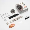 A flat lay of a KOSPET smartwatch and its accessories, including the watch itself, a black silicone strap, a metal strap, a charging cable, and a user manual, all arranged on a white background. Produktbild-Vorschau
