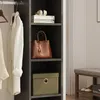 Interior view of a wardrobe with clothes, accessories, and storage boxes on shelves. Náhled obrázku produktu