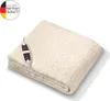 A folded cream-colored electric blanket with a black controller attached. Produktbild-Vorschau