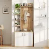 A hallway storage unit with shelves and cabinets, decorated with plants and books. Produktbild-Vorschau